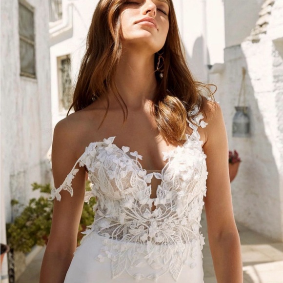 Never worn or altered wedding dress, size 12 but fits a size 4 jeans well. - Picture 6 of 6